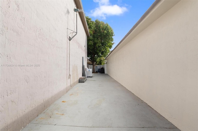 view of side of property featuring a patio