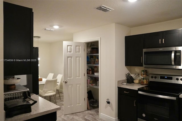 kitchen with appliances with stainless steel finishes