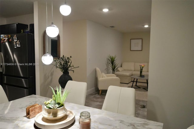 dining area featuring recessed lighting
