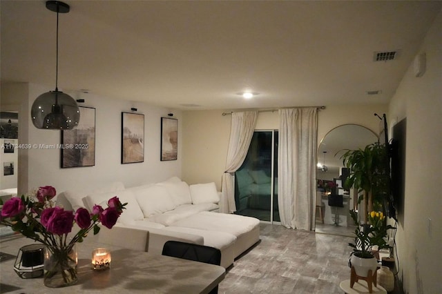 living room featuring wood finished floors and visible vents