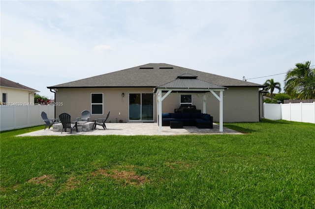back of house featuring a fenced backyard, a gazebo, outdoor lounge area, a patio area, and a lawn