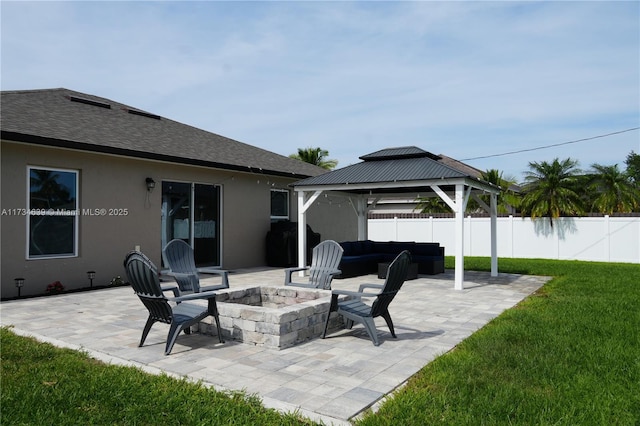 view of patio / terrace featuring a gazebo, an outdoor fire pit, and fence
