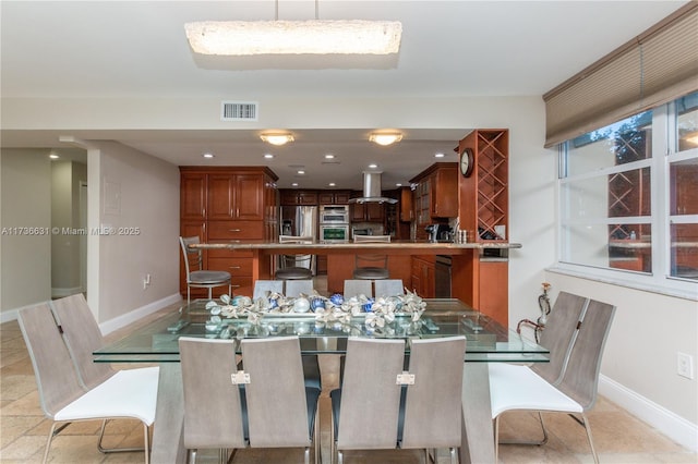 dining room with light tile patterned flooring