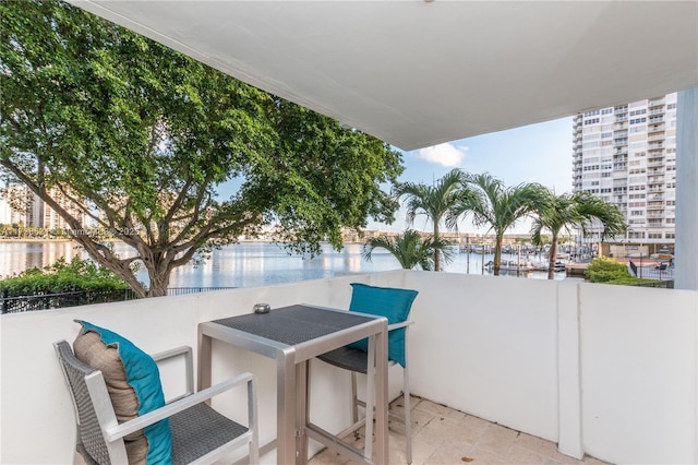 balcony featuring a water view