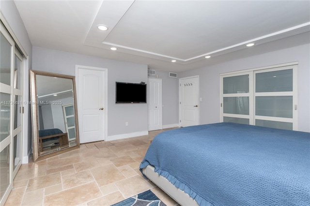 bedroom featuring a raised ceiling