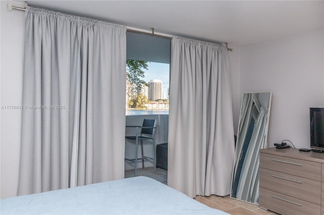 bedroom featuring light tile patterned floors