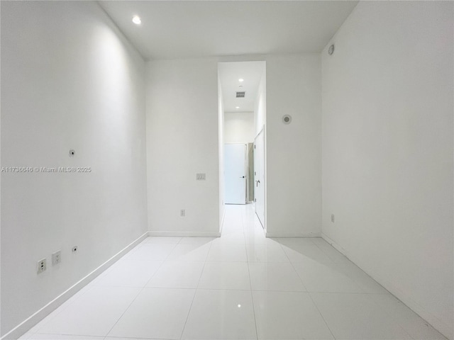 unfurnished room featuring light tile patterned floors