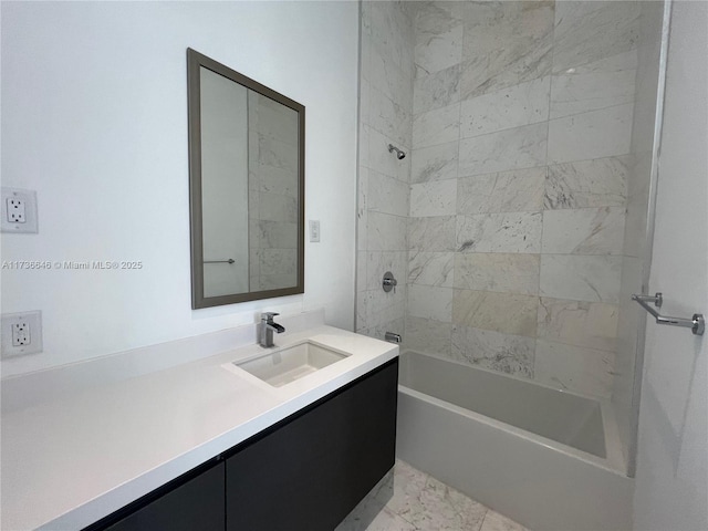 bathroom with tiled shower / bath combo and vanity