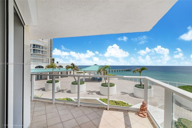 balcony featuring a water view