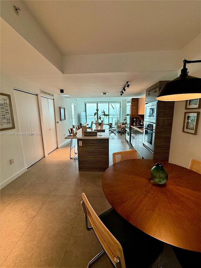 460 NE 28th St Unit 2503, Miami, FL 33137 - dining room with rail lighting and baseboards