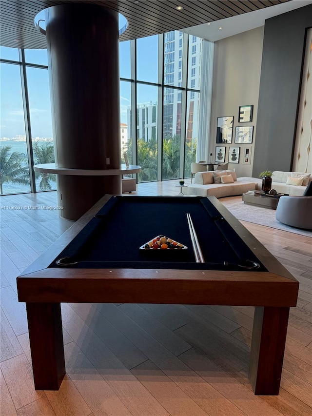 game room with pool table and expansive windows