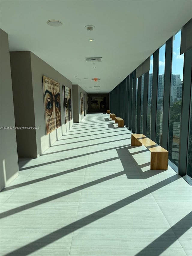 corridor featuring floor to ceiling windows