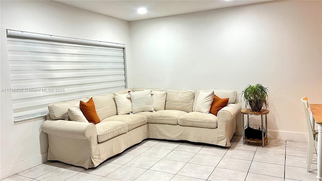 living area with recessed lighting, baseboards, and light tile patterned floors