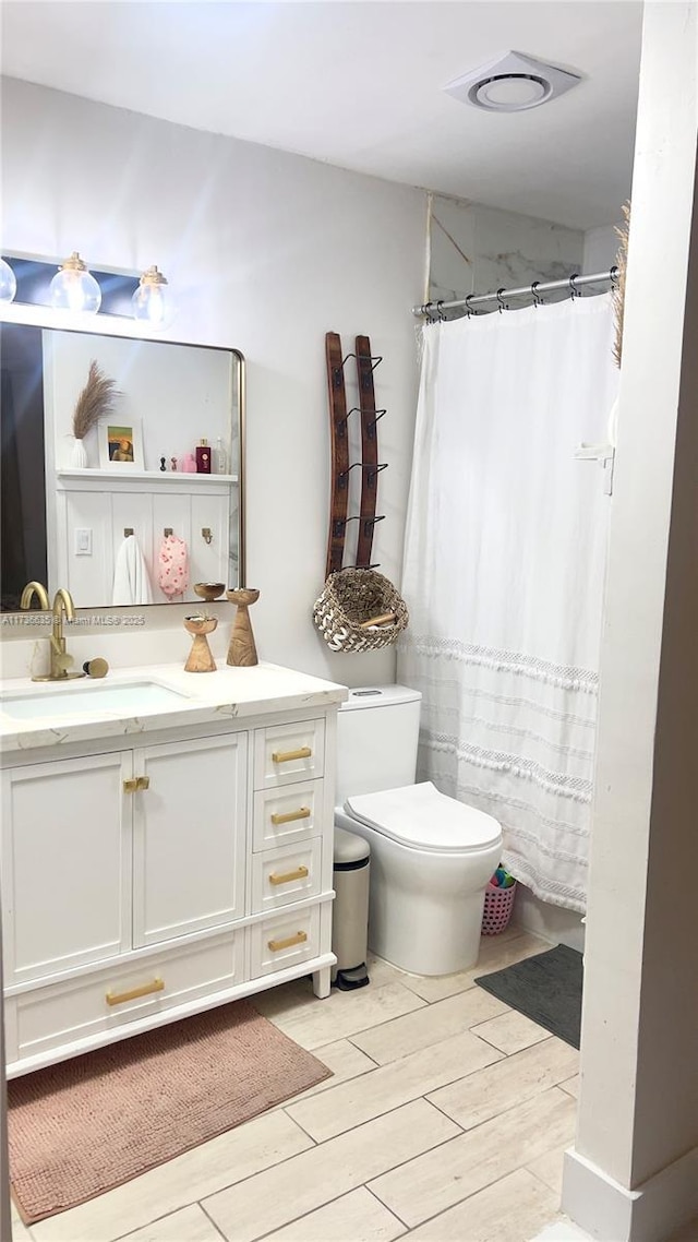 13251 SW 17th Ln Unit B1-22, Miami, FL 33175 - full bath with vanity, toilet, wood finish floors, and curtained shower