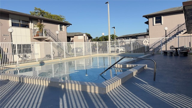 13251 SW 17th Ln Unit B1-22, Miami, FL 33175 - community pool with stairway, a patio area, and a residential view