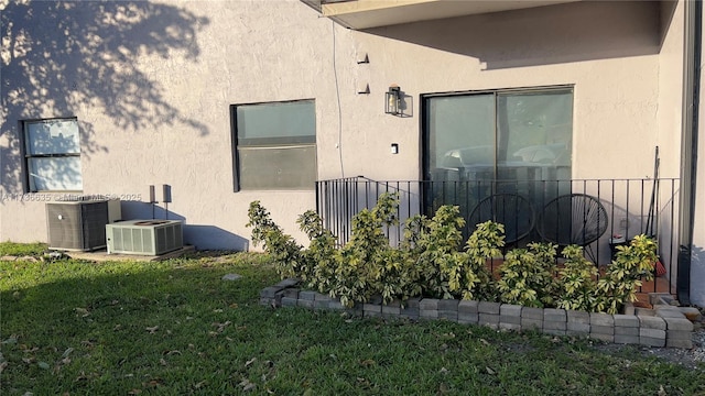 13251 SW 17th Ln Unit B1-22, Miami, FL 33175 - view of side of property with stucco siding, central AC, and a yard