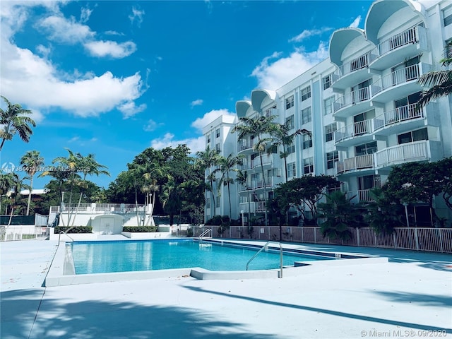 view of swimming pool with a patio area