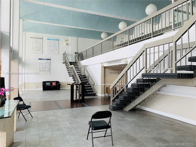 stairway with a towering ceiling