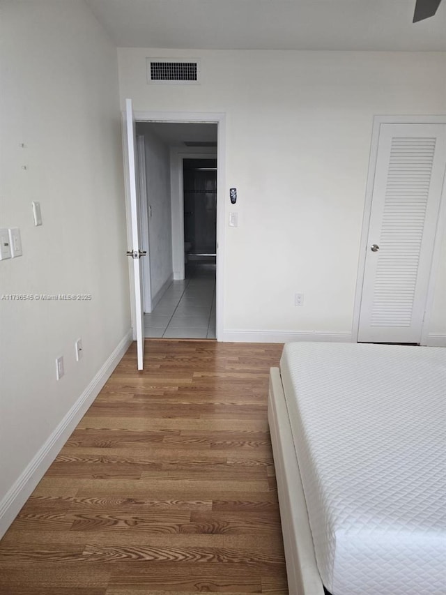 unfurnished bedroom featuring hardwood / wood-style floors