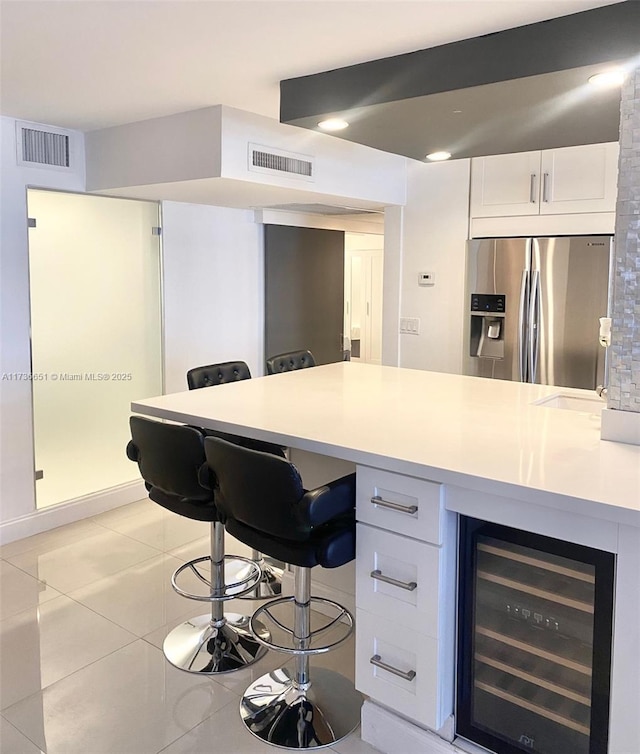 tiled office space with beverage cooler