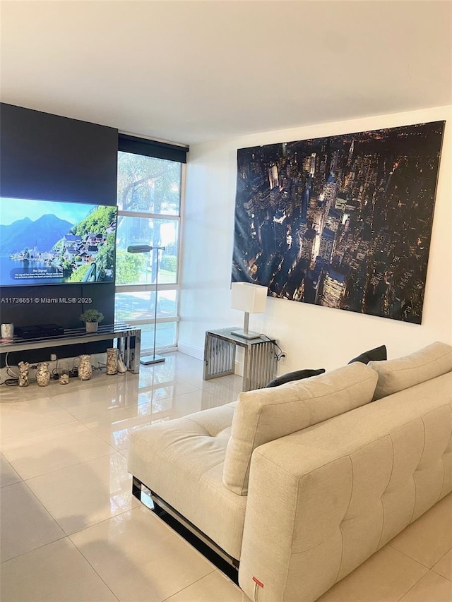 tiled living room featuring a wall of windows