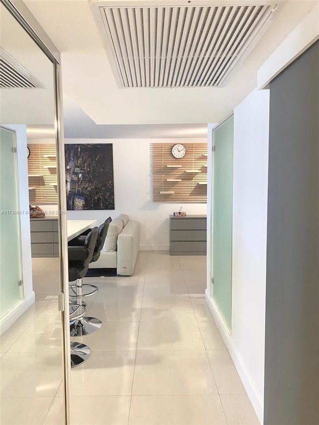 bedroom featuring light tile patterned floors