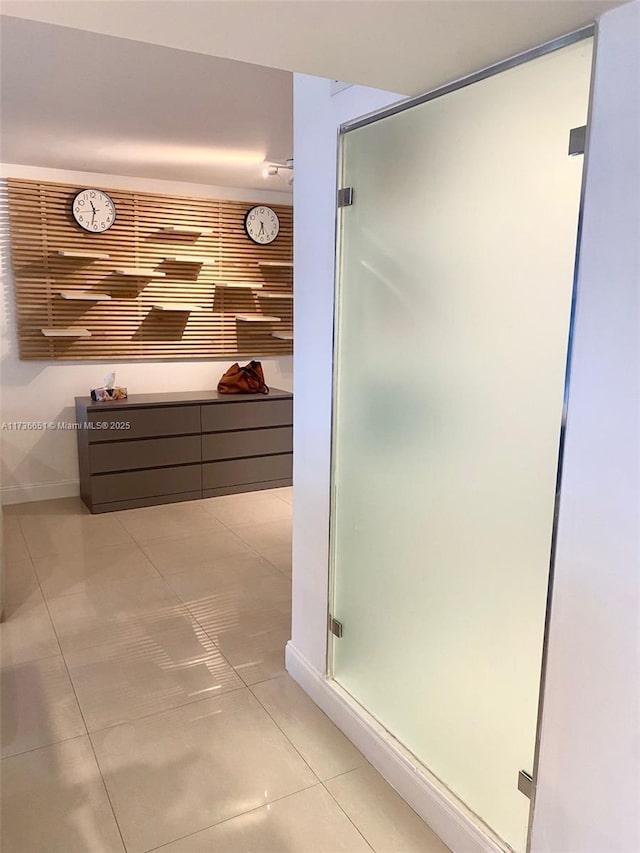 bathroom with tile patterned floors