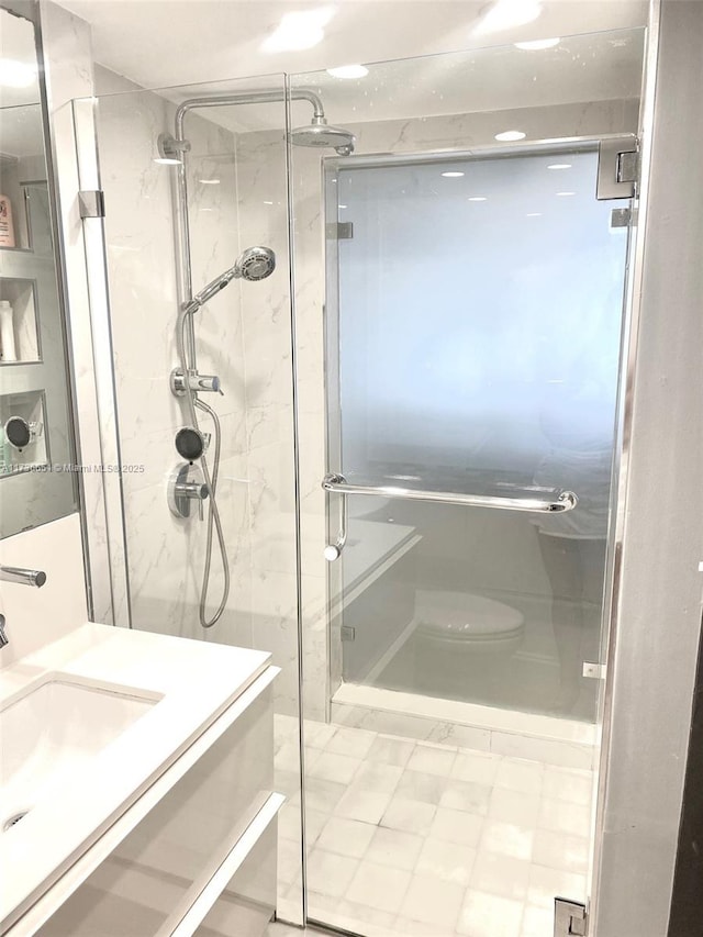 bathroom featuring vanity and walk in shower