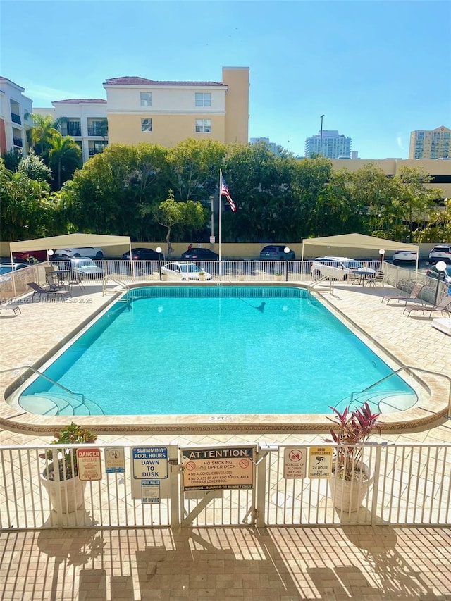 view of swimming pool with a patio area