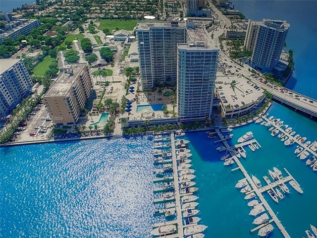 birds eye view of property with a view of city and a water view