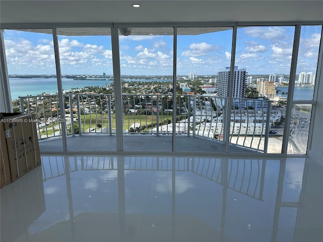 interior space with a view of city and a water view