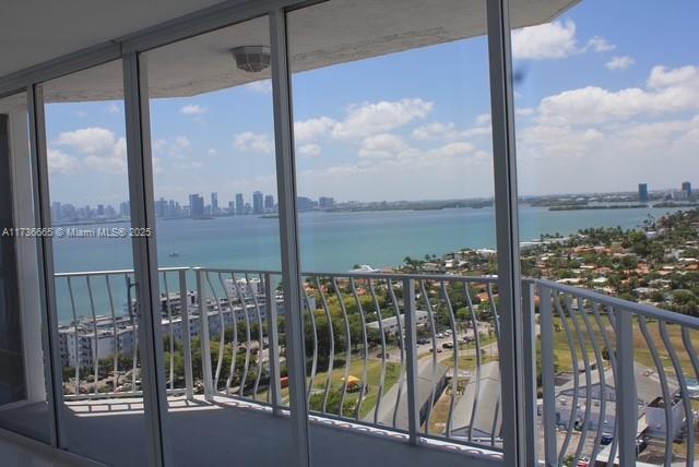 balcony with a city view and a water view