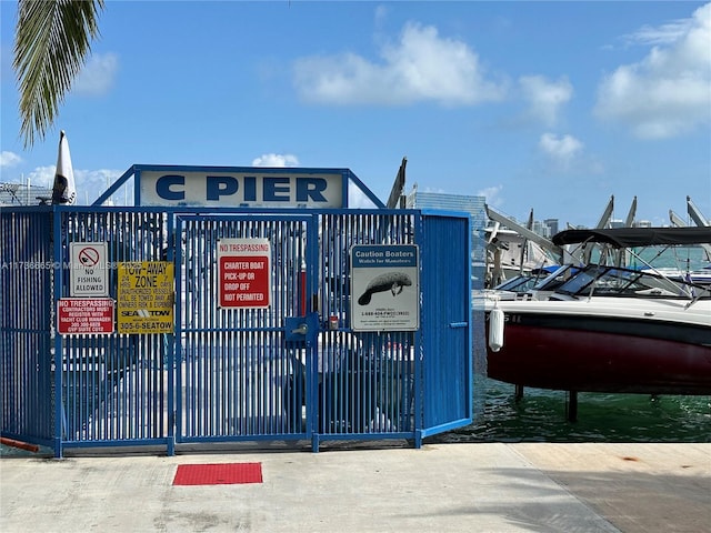 view of gate featuring fence