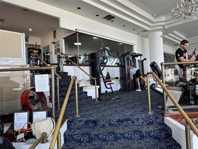 exercise room featuring carpet flooring and visible vents