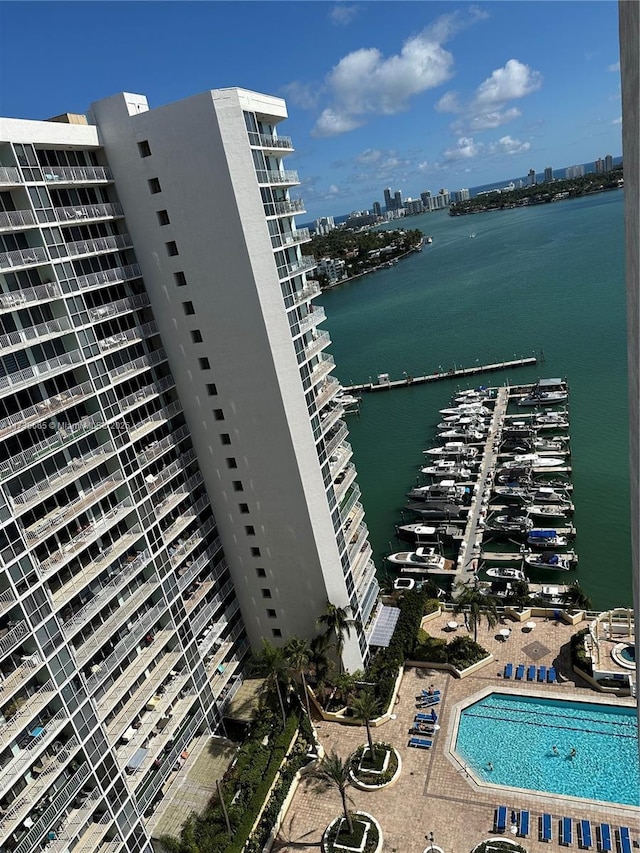 exterior space with a water view and a city view