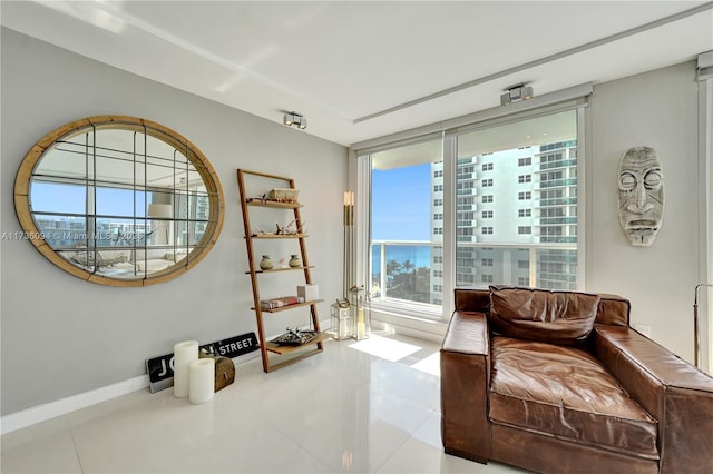 living area with tile patterned flooring