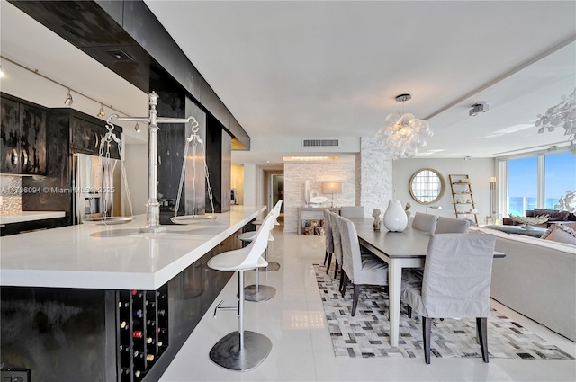 dining space featuring light tile patterned floors