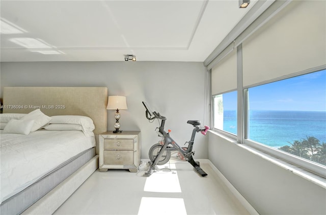 bedroom featuring a water view