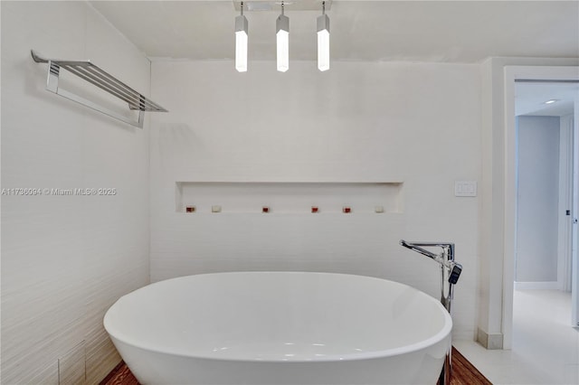 bathroom featuring a washtub