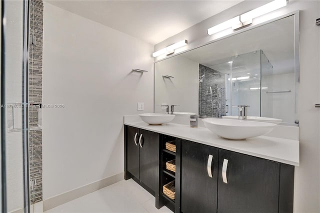 bathroom featuring vanity, tile patterned flooring, and a shower with shower door