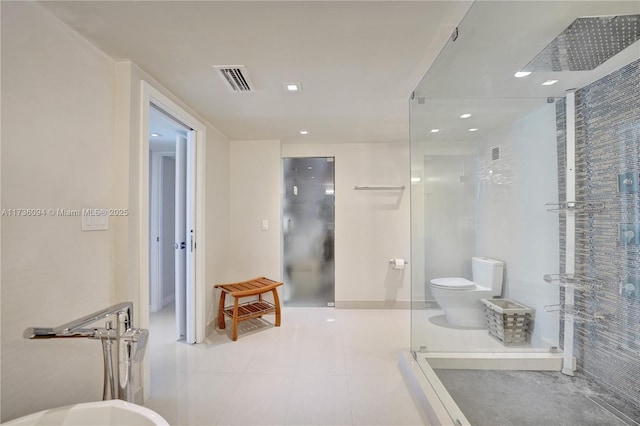 bathroom with a shower, tile patterned floors, and toilet