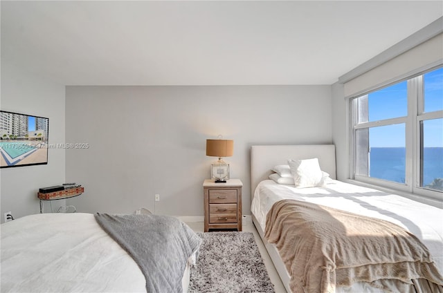 bedroom with a water view