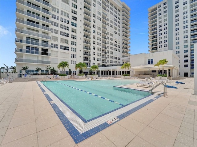 view of swimming pool with a patio