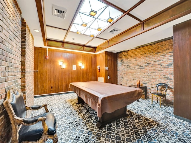 rec room with brick wall, billiards, carpet, and wood walls