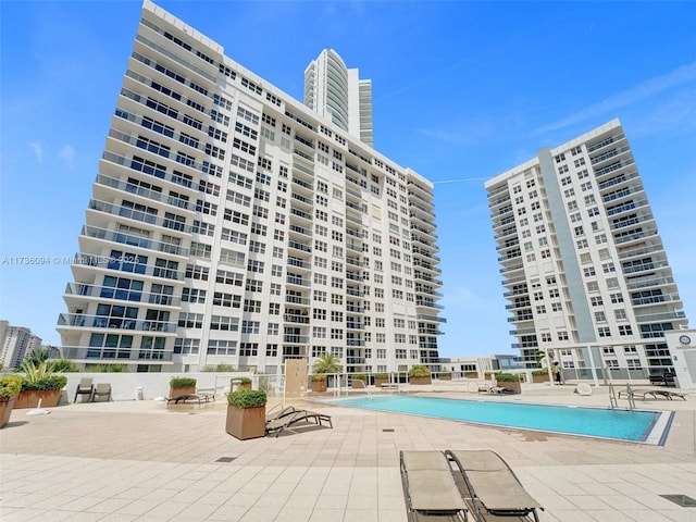 view of swimming pool featuring a patio area