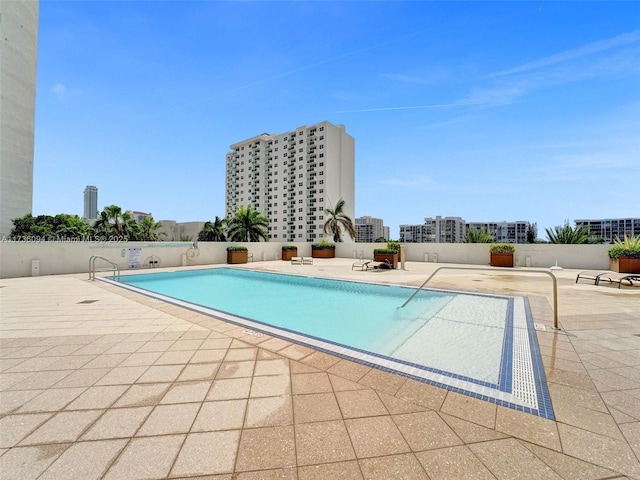 view of swimming pool with a patio area