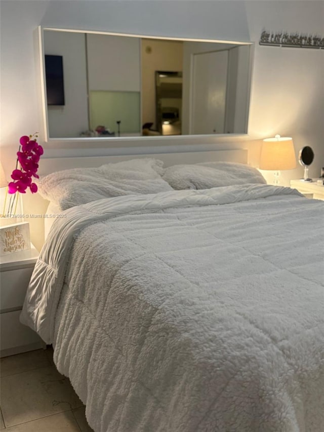 bedroom featuring light tile patterned floors