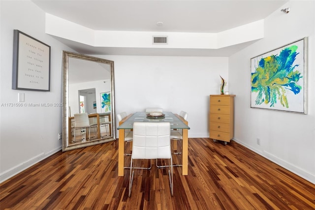 dining space featuring dark hardwood / wood-style floors