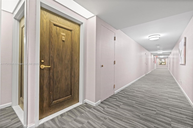 hallway featuring carpet flooring