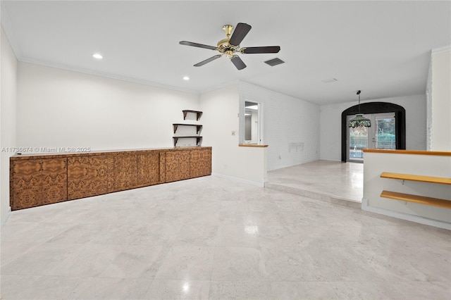 empty room featuring ornamental molding and ceiling fan